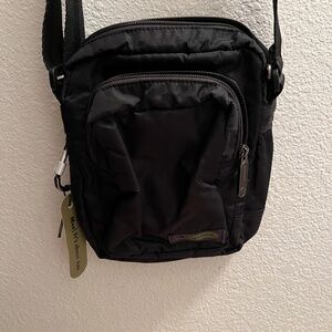 NWT Lesportsac travel pouch with adjustable shoulder strap